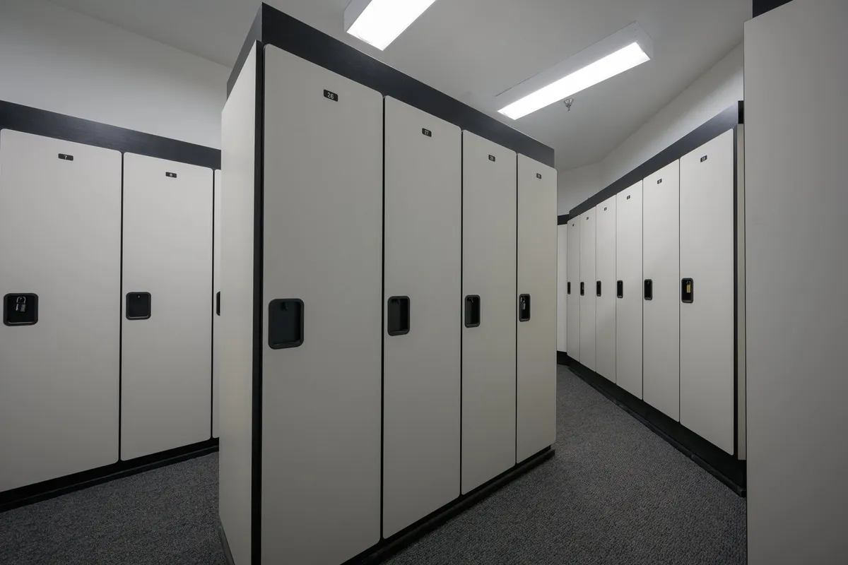 A clean, functional row of lockers located indoors, suggesting convenient storage for personal or adventure equipment. The image conveys a sense of order and preparation for activities like skiing, biking, or using the recreation center.